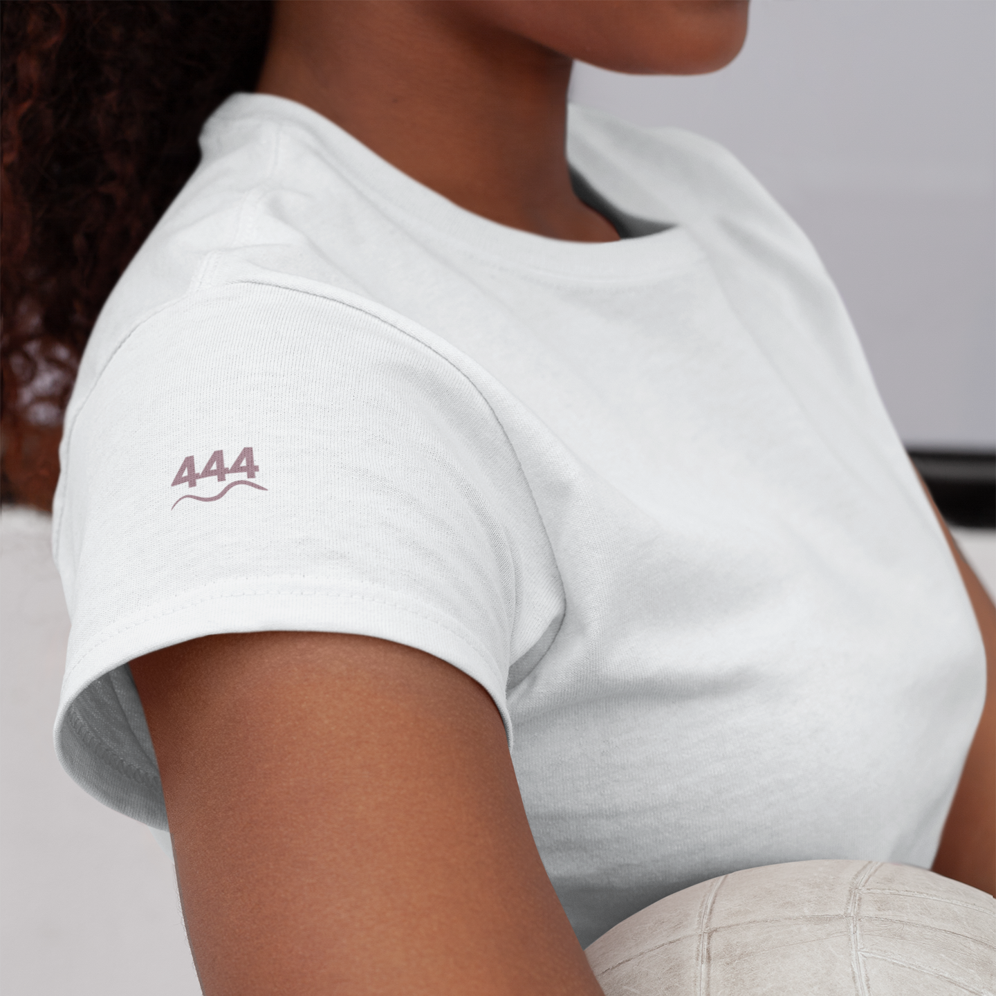White Aura T-shirt with 444 angel number and soft wave line printed in mauve on the left sleeve — symbolic of protection, inner strength, and divine grounding by Soft Frequencies™