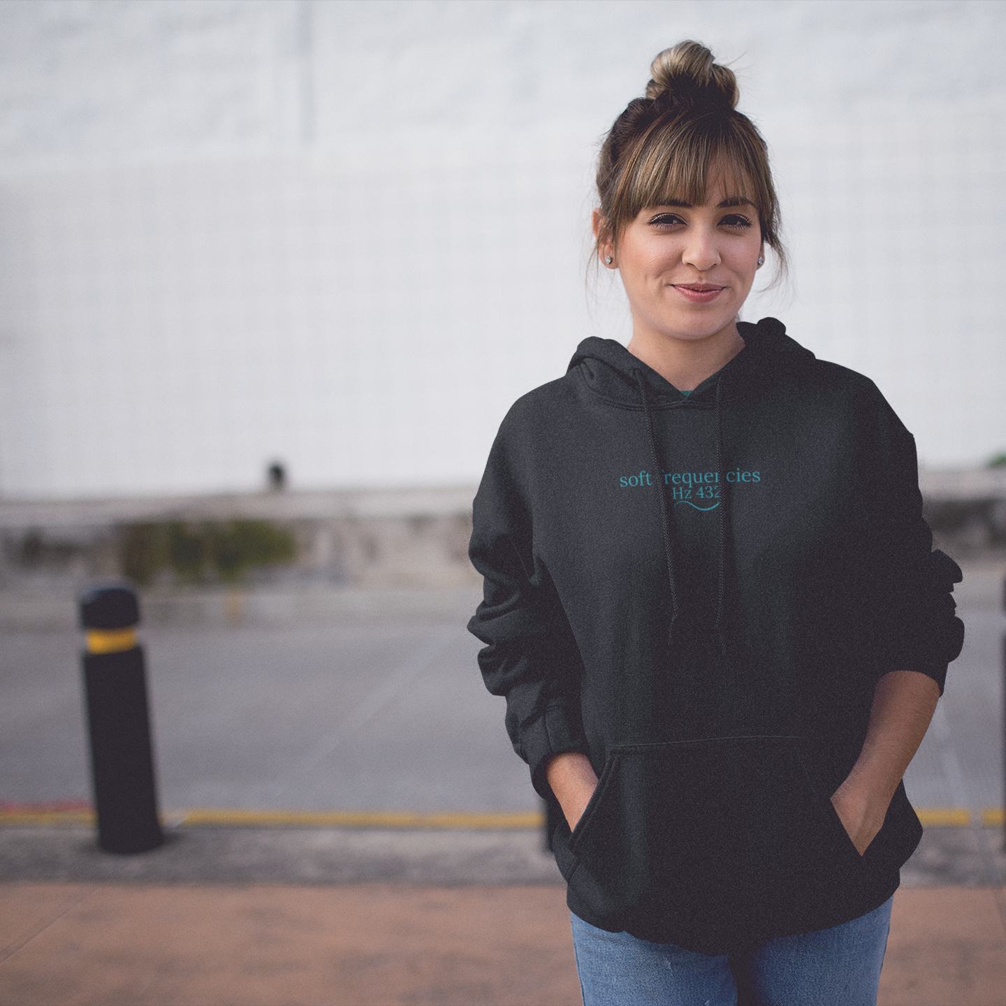 Women in Black hoodie with teal 444 embroidery and Hz 432 Soft Frequencies™ logo – spiritual frequencywear